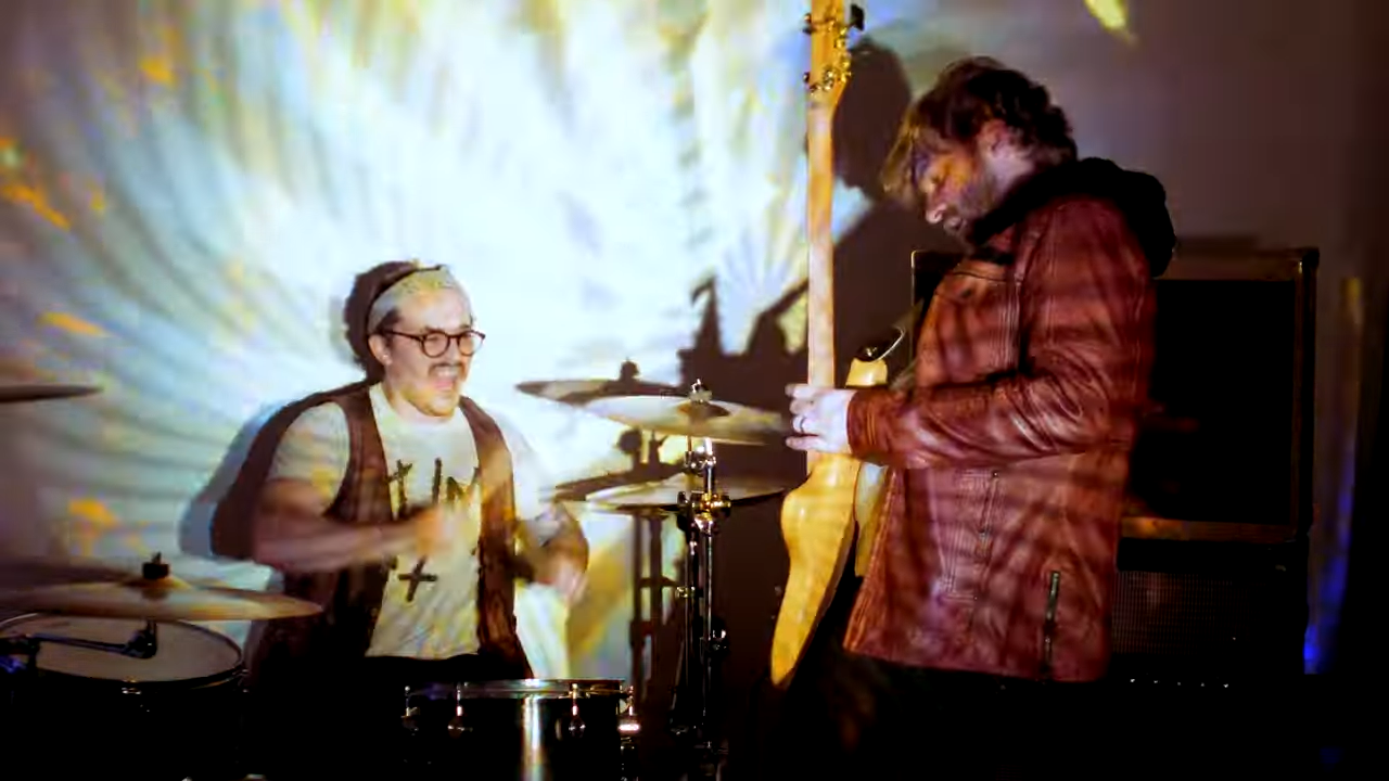 Screenshot from the video for "Shadow Out Of Time," featuring Moucha on drums and vocals and Doug Gluth on bass.